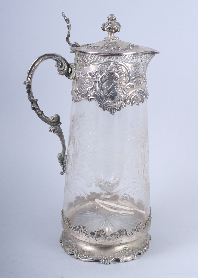 A late 19th century cut glass lemonade jug with Austro Hungarian 800 grade silver mounts