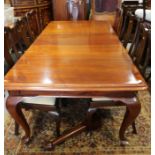A late 19th century mahogany extending dining table with three extra leaves, on cabriole supports,