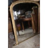 An 19th century arch top gilt framed overmantel mirror, plate 49" x 38"
