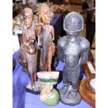 An African carved hardstone portrait bust, 7" high, and two African hardwood figures, 19" high