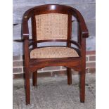A teak/hardwood double bergere desk elbow chair
