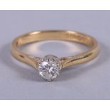 An 18ct gold ring set solitaire diamond, size K, 2.6g