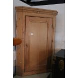 A 19th century stripped pine corner cupboard enclosed panel door, 32" wide