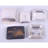 A pair of 1950s silver square ashtrays with engine turned decoration, a silver cigarette box, a