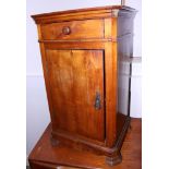 A cherrywood bedside cupboard, fitted drawer, on shaped supports, 16" wide