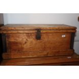 A waxed pine and wrought iron panel chest, 33" wide