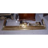 A brass fender curb, 50" wide, a set of three brass fire irons and other metal wares