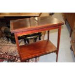 An Edwardian mahogany and kingwood banded fold-over top patience table, 26" wide