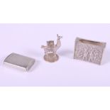 A Victorian silver vesta case, by George Unite, a Continental white metal match box sleeve with