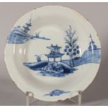 An 18th century Lambeth? delft shallow bowl with chinoiserie pavilion decoration, 6 3/4" dia (