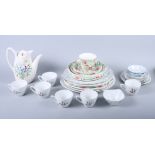 A Midwinter "Bouquet" pattern part coffee service for six, a matching side and dinner plate, two