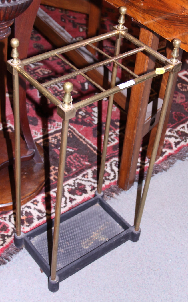 A brass and cast iron six-division stick stand
