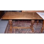 An oak refectory style table, on carved cup and cover supports, top 60" x 30" and four oak frame