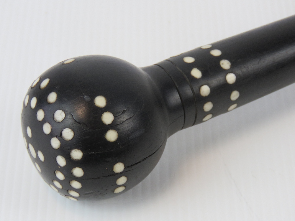 An ebony swagger stick with inset ivory