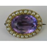 A 15ct amethyst and seed pearl brooch, c