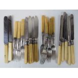 Twenty assorted vintage knives and forks