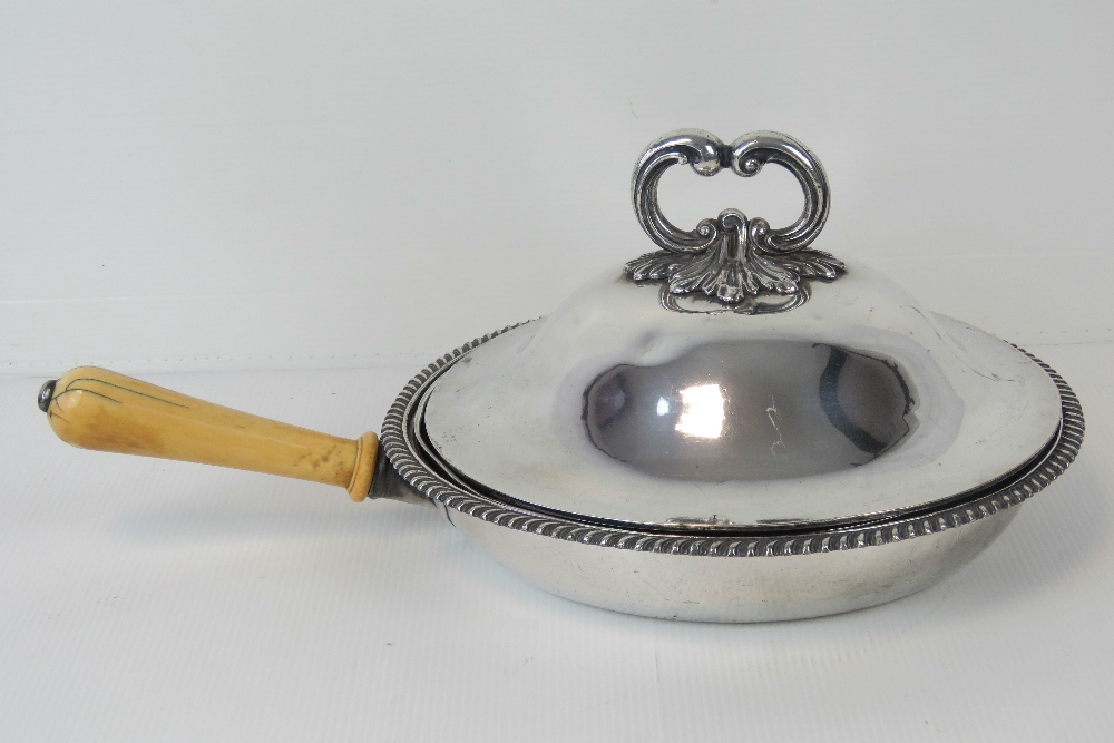 A silver plated breakfast dish with ivor