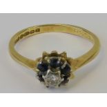 An 18ct gold diamond and sapphire ring,