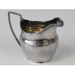 A Georgian HM silver cream jug, standing