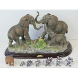 A large figurine of three elephants by T