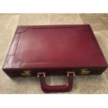 A fine burgundy leather brief case with
