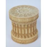 A short cylindrical screw top ivory box