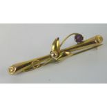 A 9ct gold and amethyst bar brooch, flor