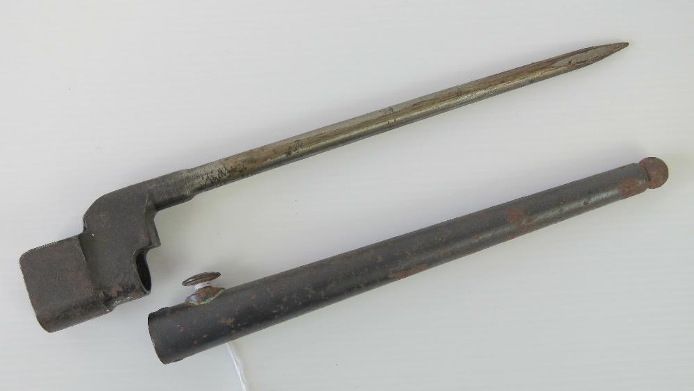 A .303 Lee Enfield spike bayonet and scabbard, 25.5cm in length.