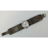 A J.W. Benson silver trench watch, white enamel dial marked J.W.