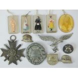 A mixed lot of WWI and WWII German badges including War Merit Cross,