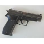 A deactivated (EU Spec) Sig P226 Semi Automatic 9mm military pistol, serial number U165592.