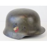 A WWII German helmet, later painted havi