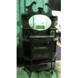 An Edwardian mirror-back short chiffonier having central bevel-edged mirror,