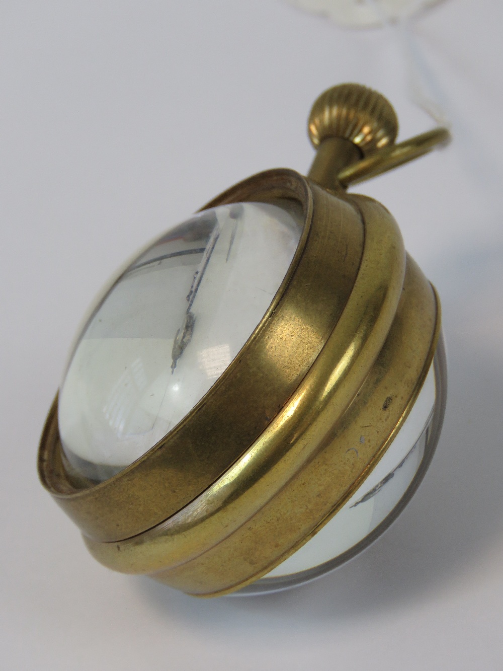 A brass cased 20th century spherical pocket watch marked 'Aeroplane Livre' to the face and - Image 2 of 3