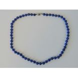 A lapis lazuli bead necklace, beads knotted individually, 925 silver clasp, approx 54cm in length.