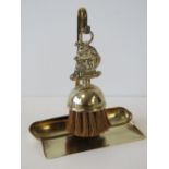 A brass crumb scoop and brush set, ship motif to brush, standing 19cm high.