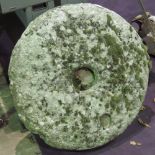 An antique Millstone grit circular mill wheel approx 66cm dia.