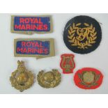 A pair of Royal Marines badges including; slip ons, Kings badge, cloth badges,