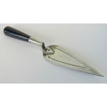 A delightful HM silver miniature bookmark in the form of a trowel, complete with onyx handle,