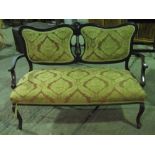 A mahogany framed Edwardian salon settee with upholstered seat and matching back rest.