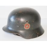 A WWII German RAD Party helmet, later painted having applied double decal,