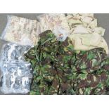 A box of mixed US and British military camo sets including US Desert tri-colour Marine issue,