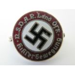 An enamelled Nazi Party badge measuring 2cm dia.