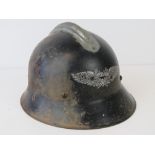 A WWII German Luftschutz helmet issued to Home Guard units, good decal,