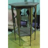 A smart and small mahogany hexagonal side table of Art Nouveau influence standing 66cm high and