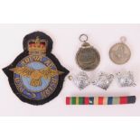 A German WWII Winterschlacht Imosten 1941/42 Eastern Front medal, an RAF cloth badge,