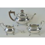 A HM silver three piece tea service comprising teapot, milk jug and sugar bowl,