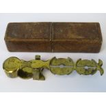An unusual set of scales for weighing sovereigns and half sovereigns,