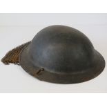 A WWI British Brodie tank helmet.