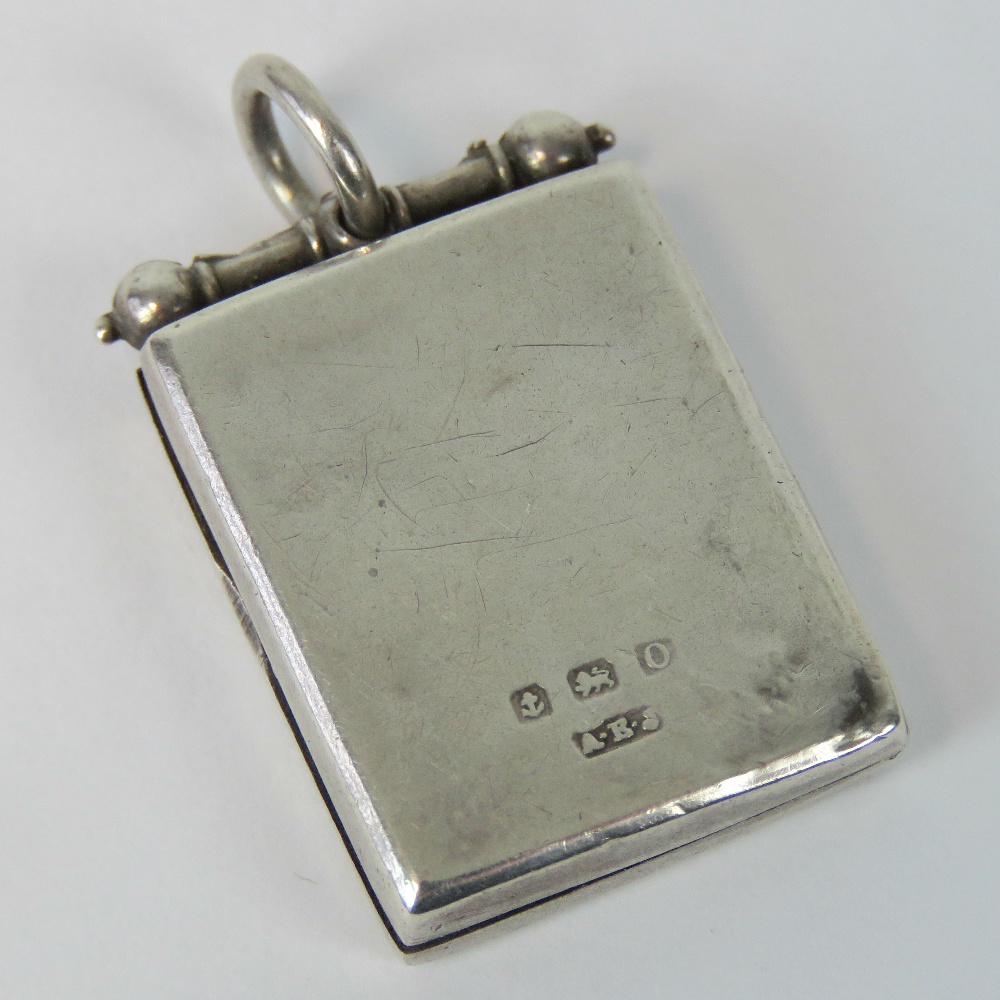 A HM silver locket of rectangular form, Birmingham 1938, 3.5cm including bale. - Image 3 of 3